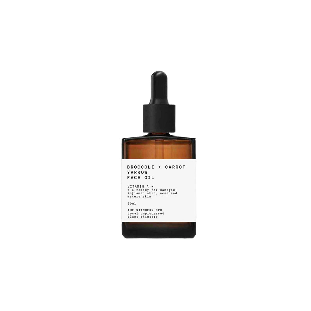 Broccoli + Carrot + Yarrow Face Oil by The Witchery CPH in a small amber glass dropper bottle with a white label and black cap, centered on a plain white background.