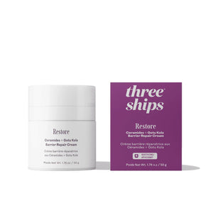 Three Ships Restore Ceramides + Gotu Kola Barrier Repair Cream in a white jar next to its purple packaging box, on a clean white background.