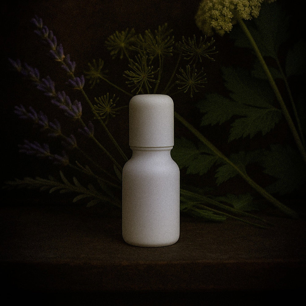 Tidelands House Grain D'Aneth & Lavande Huile de Parfum No. 2 botanical perfume oil in milk glass roller bottle with dark background