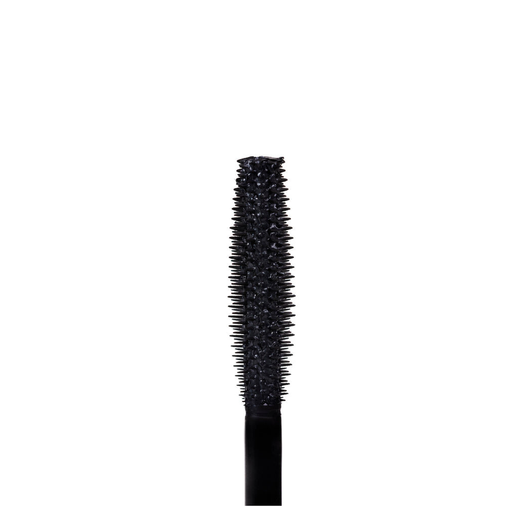 TOK Beauty Eyes That TOK Lash Enhancing Mascara in eco-friendly packaging, featuring a silicone wand for volume and length. Plant-based formula with horsetail plant, pea protein, and bayberry wax.