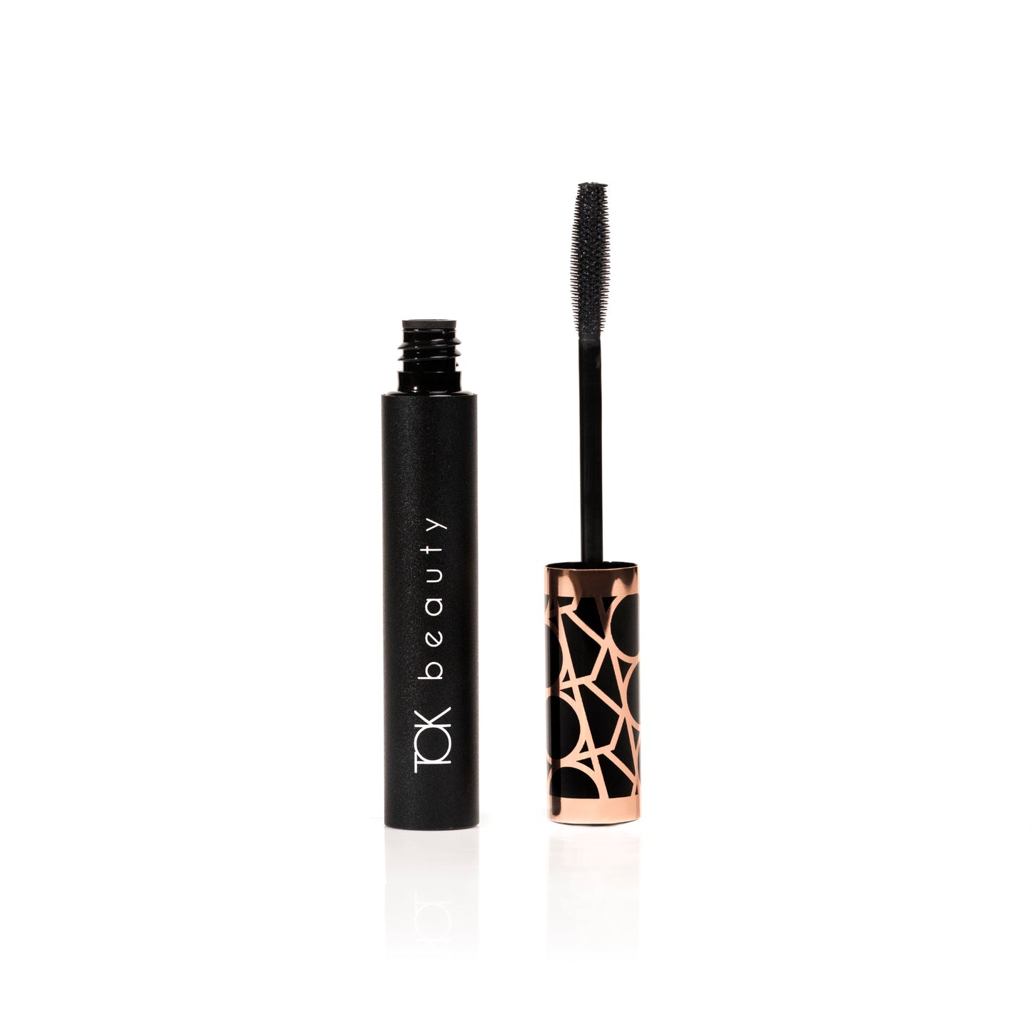 TOK Beauty Eyes That TOK Lash Enhancing Mascara in eco-friendly packaging, featuring a silicone wand for volume and length. Plant-based formula with horsetail plant, pea protein, and bayberry wax.