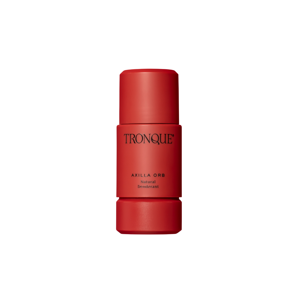 Red deodorant stick with 'Tronque' branding on a white background. TRONQUE Natural Deodorant