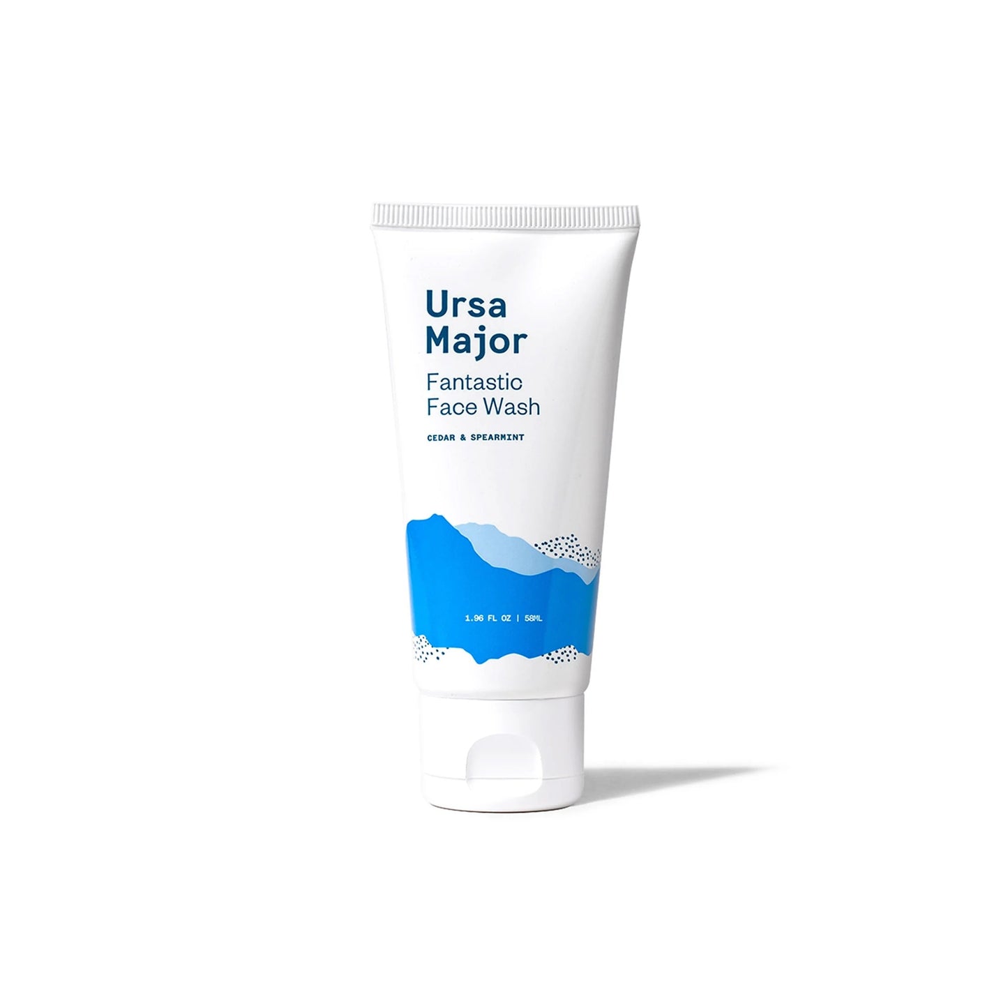 Ursa Major Fantastic Face Wash Traveler, a travel-sized tube of foaming gel cleanser, featuring a honey-colored formula and fresh aroma of cedar, lime, and spearmint.