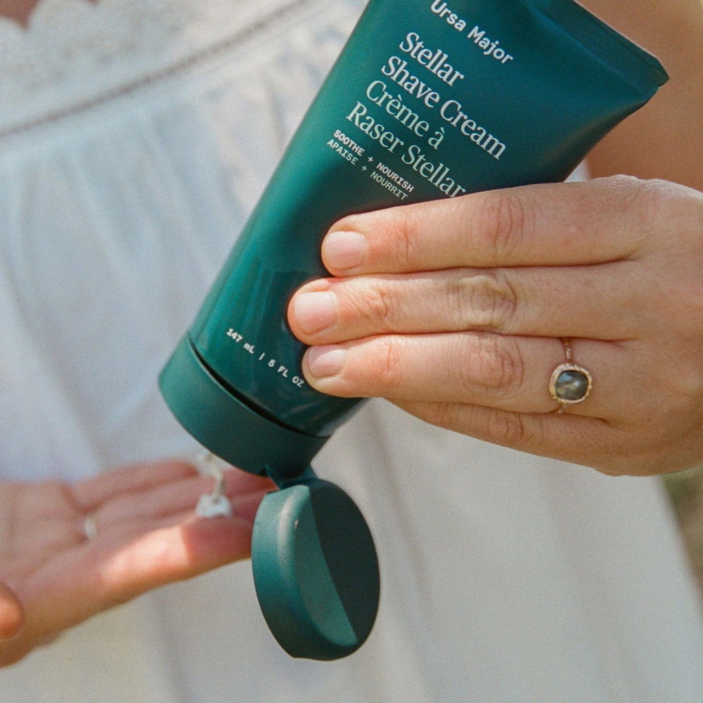 Ursa Major Stellar Shave Cream tube with natural ingredients and forest-inspired scent notes including ginger, grapefruit, vetiver, and bergamot.