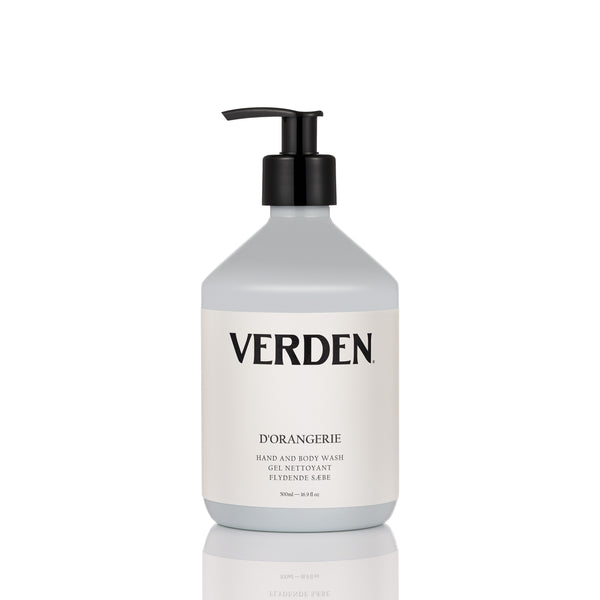 A bottle of Verden D'Orangerie hand and body wash with a black pump dispenser and a white label, set against a clean white background with a subtle reflection below.