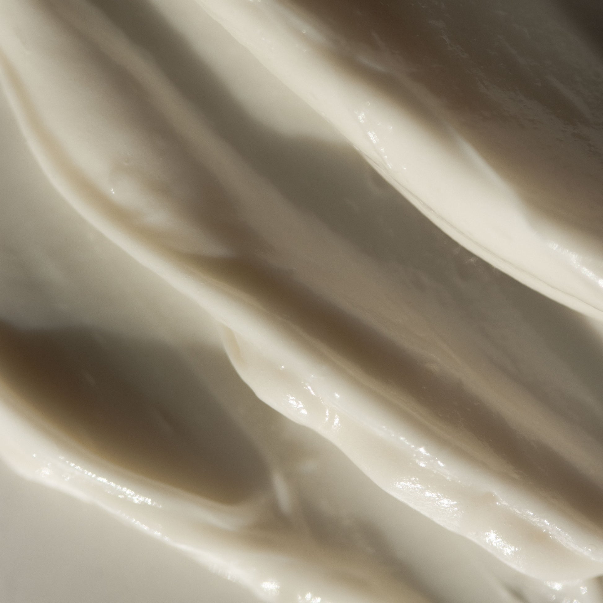 Close-up of smooth, white cream texture of VINTAGE NOON Vacation Skin Overnight Mask and Moisturizer.