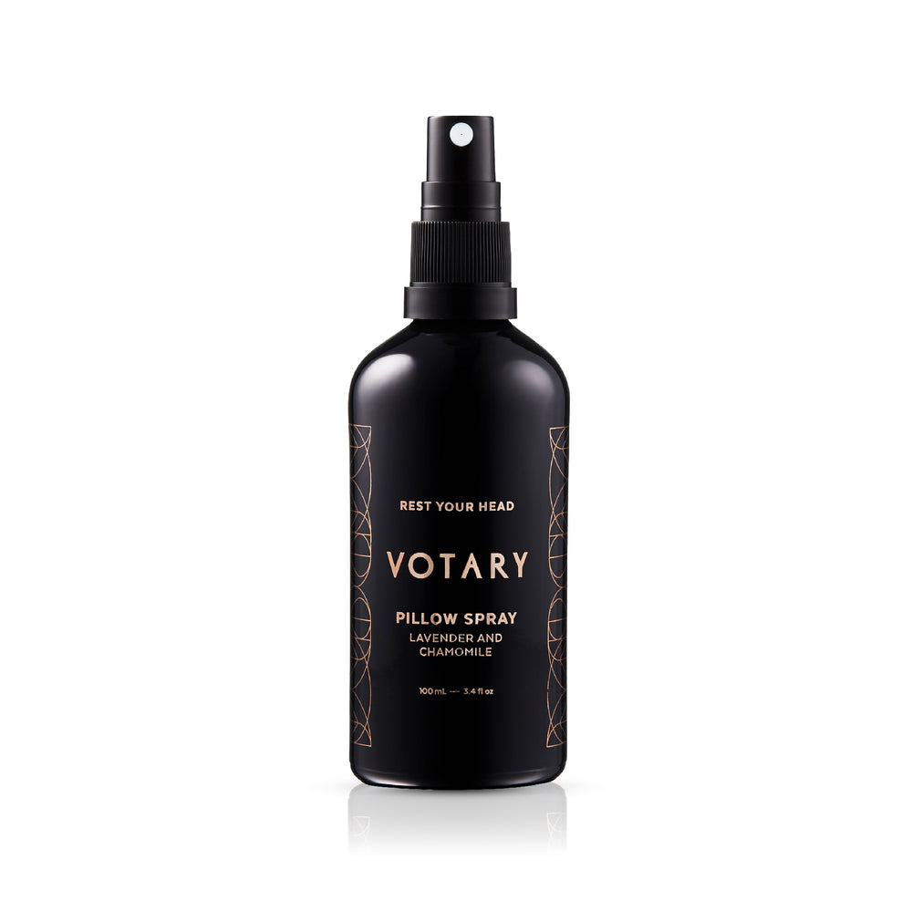Black bottle of Votary pillow spray on a white background