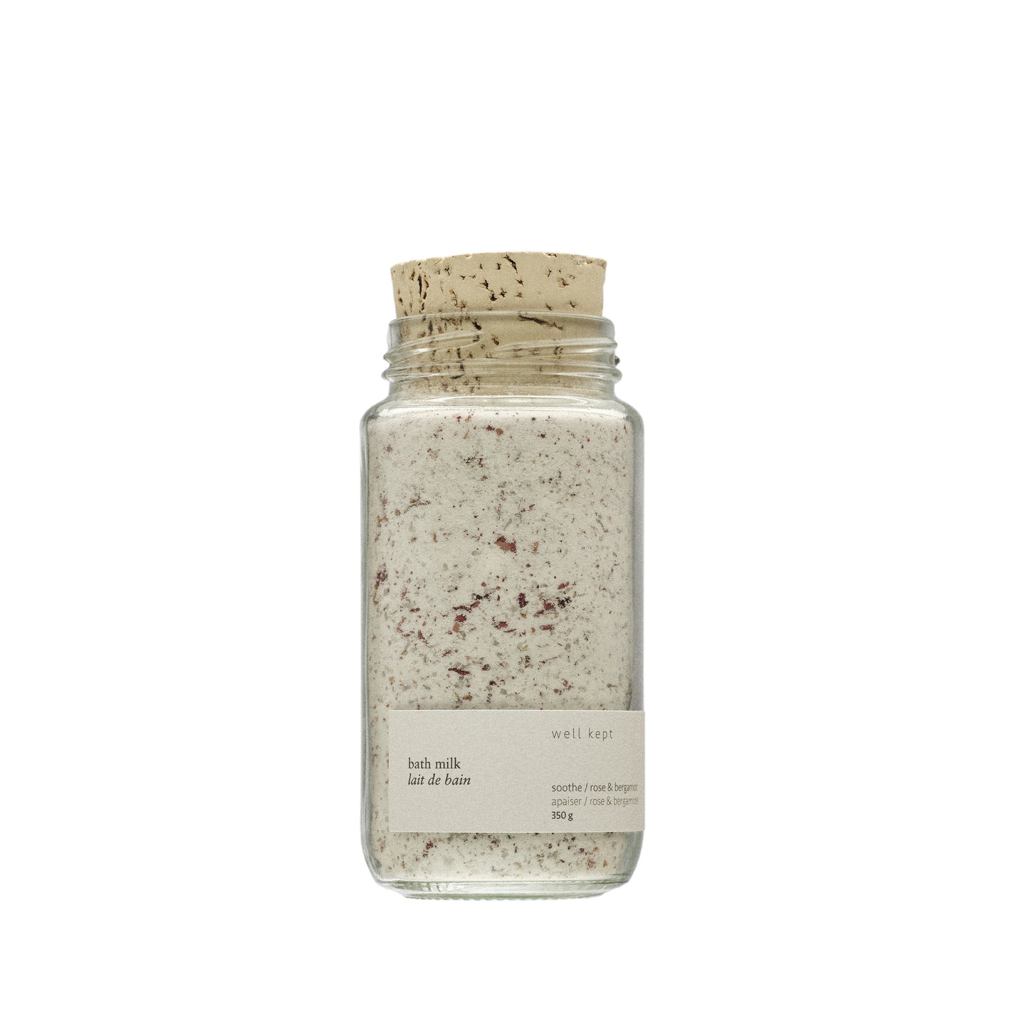 Well Kept Soothe vegan bath milk in a glass bottle, featuring a blend of coconut milk, Epsom salts, rose petals, and essential oils, perfect for a calming bath experience.