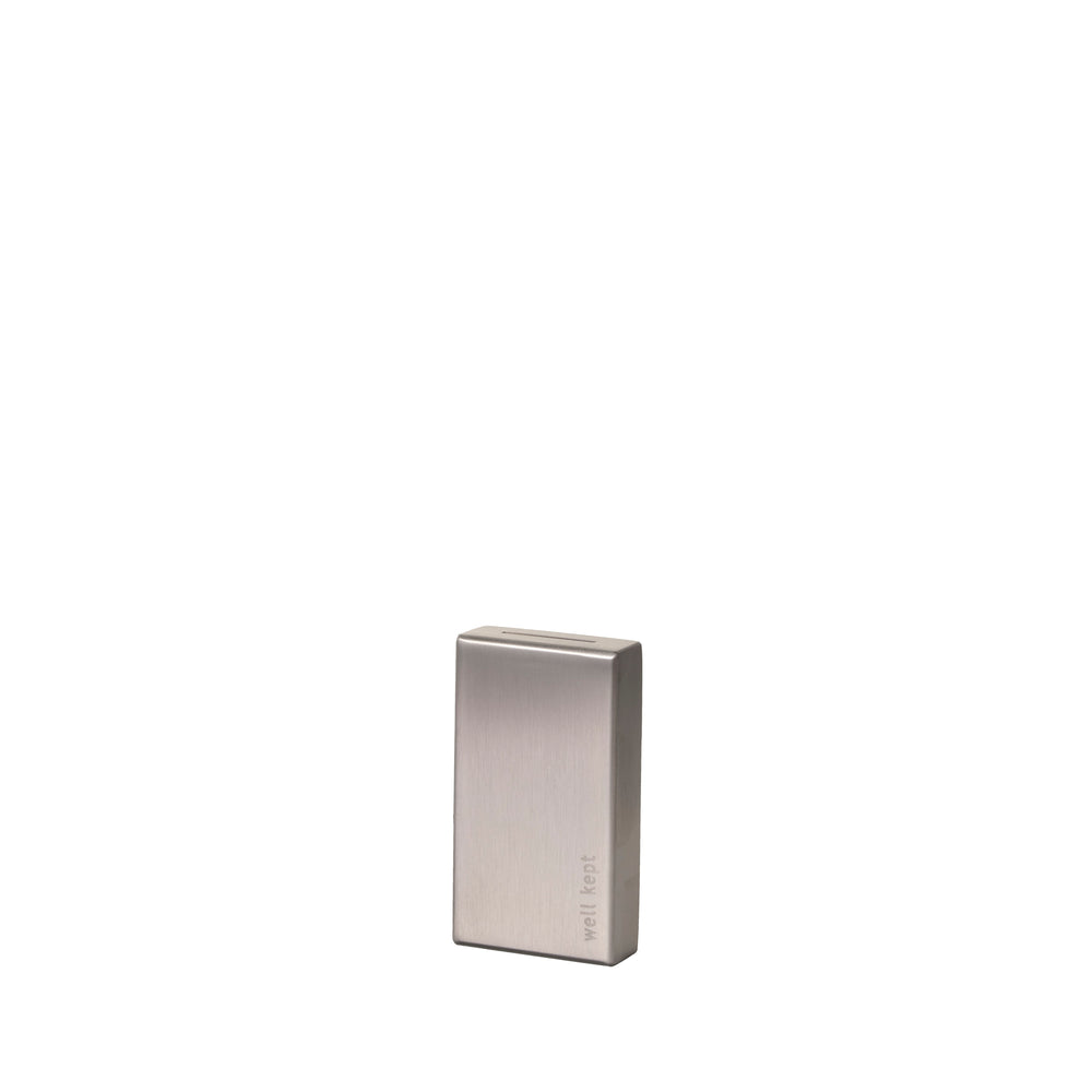 Well Kept Blade Bank, a compact stainless steel container for safe storage and recycling of used razor blades.