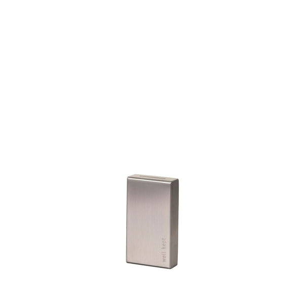 Well Kept Blade Bank, a compact stainless steel container for safe storage and recycling of used razor blades.