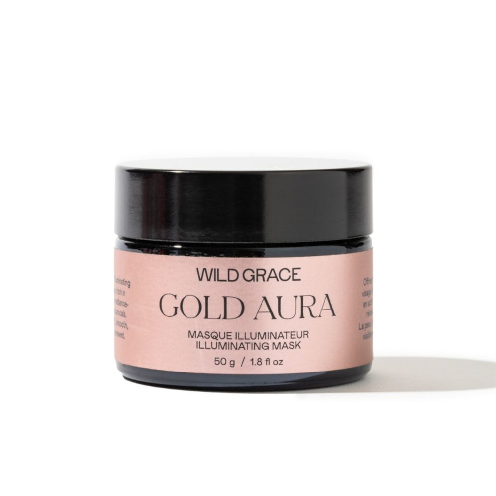 Wild Grace Gold Aura Illuminating Mask in a black jar with a dusty pink label, set against a plain white background.