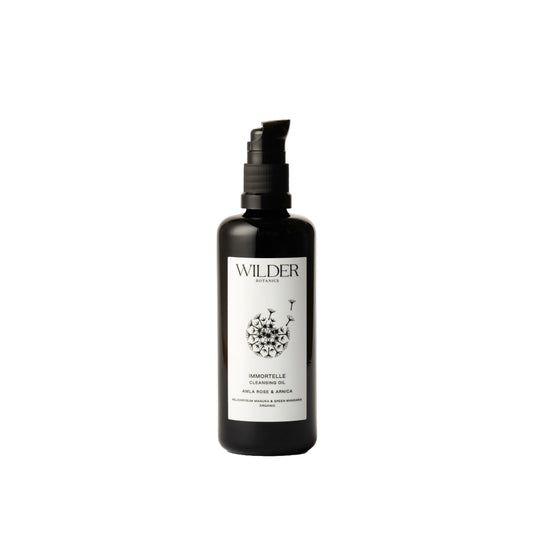 Wilder Botanics Immortelle Cleansing Oil with wild-grown Helichrysum, organic Rose, Amla, and Arnica oils for a natural, antioxidant-rich cleansing experience.