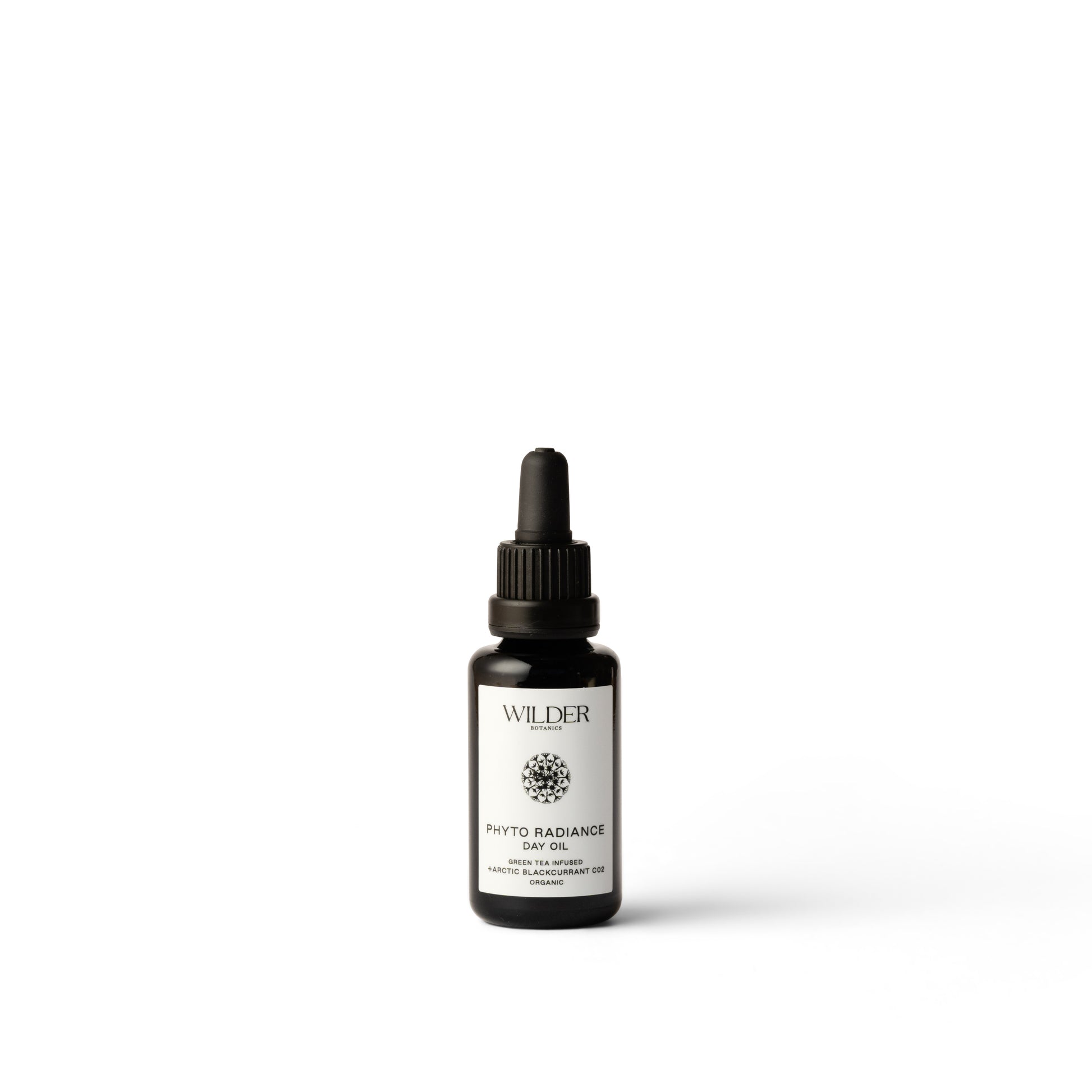 Wilder Botanics Phyto Radiance Day Oil in a glass bottle with a dropper, showcasing a blend of antioxidants and natural ingredients like Prickly Pear Seed Oil and Green Tea Extract for a glowing, well-hydrated complexion.