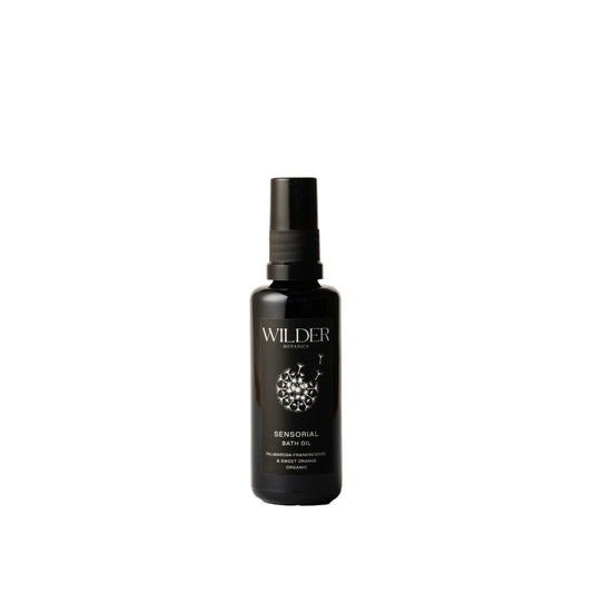 Wilder Botanics Sensorial Bath Oil with Palmarosa, Frankincense, and Sweet Orange in a 50ml bottle, providing hydrating and calming benefits for all skin types.