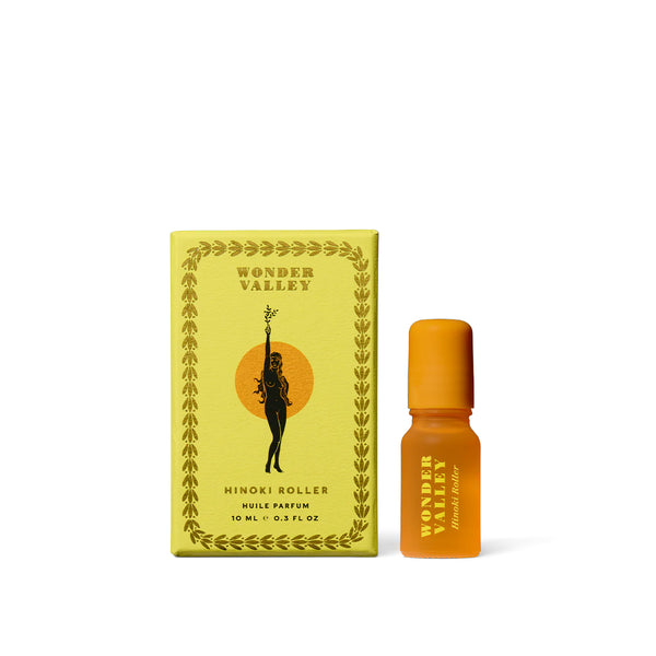 Wonder Valley Hinoki Roller essential oil perfume with hinoki, cedarwood, and fir in a sleek glass rollerball for grounding, wearable scent.