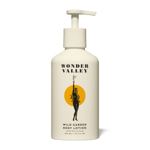 Wonder Valley Wild Garden Body Lotion in a sleek pump bottle, enriched with olive oil, shea butter, squalane, and sea buckthorn. Luxurious cream with notes of cedar, basil, rosemary, sage, mint, lavender, bay, and vetiver.