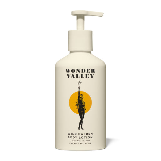 Wonder Valley Wild Garden Body Lotion in a sleek pump bottle, enriched with olive oil, shea butter, squalane, and sea buckthorn. Luxurious cream with notes of cedar, basil, rosemary, sage, mint, lavender, bay, and vetiver.