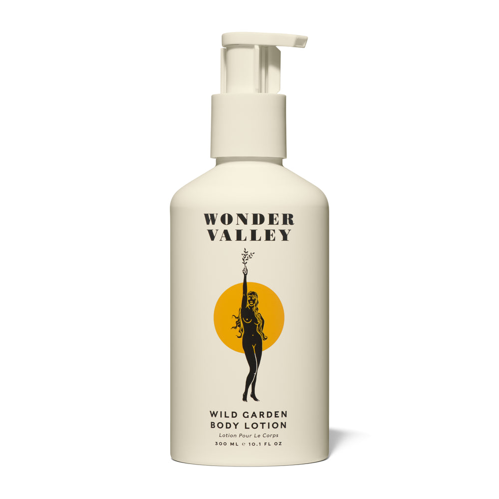Wonder Valley Wild Garden Body Lotion in a sleek pump bottle, enriched with olive oil, shea butter, squalane, and sea buckthorn. Luxurious cream with notes of cedar, basil, rosemary, sage, mint, lavender, bay, and vetiver.