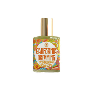 Wonderlust Botanicals California Dreaming perfume oil in a 0.5 oz roll-on bottle with a fresh, woodsy, and citrusy aroma.