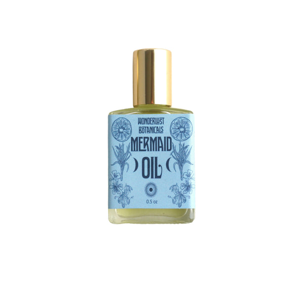Mermaid Perfume Oil by Wonderlust Botanicals – Tropical fragrance with essential oils of lemongrass, bergamot, and ylang-ylang in a 0.5 oz roll-on bottle.