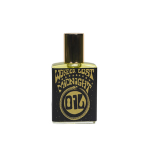 WONDERLUST BOTANICALS Midnight Oil natural roll-on perfume in a 0.5 oz glass bottle, featuring an enchanting blend of jasmine, frankincense, bergamot, vetiver, and ylang ylang.