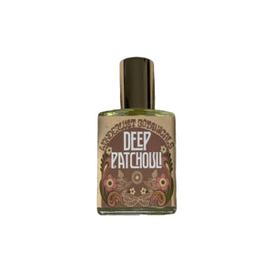 Wonderlust Botanicals Deep Patchouli Perfume Oil in a 0.5 oz roll-on bottle, featuring an earthy and woody fragrance.