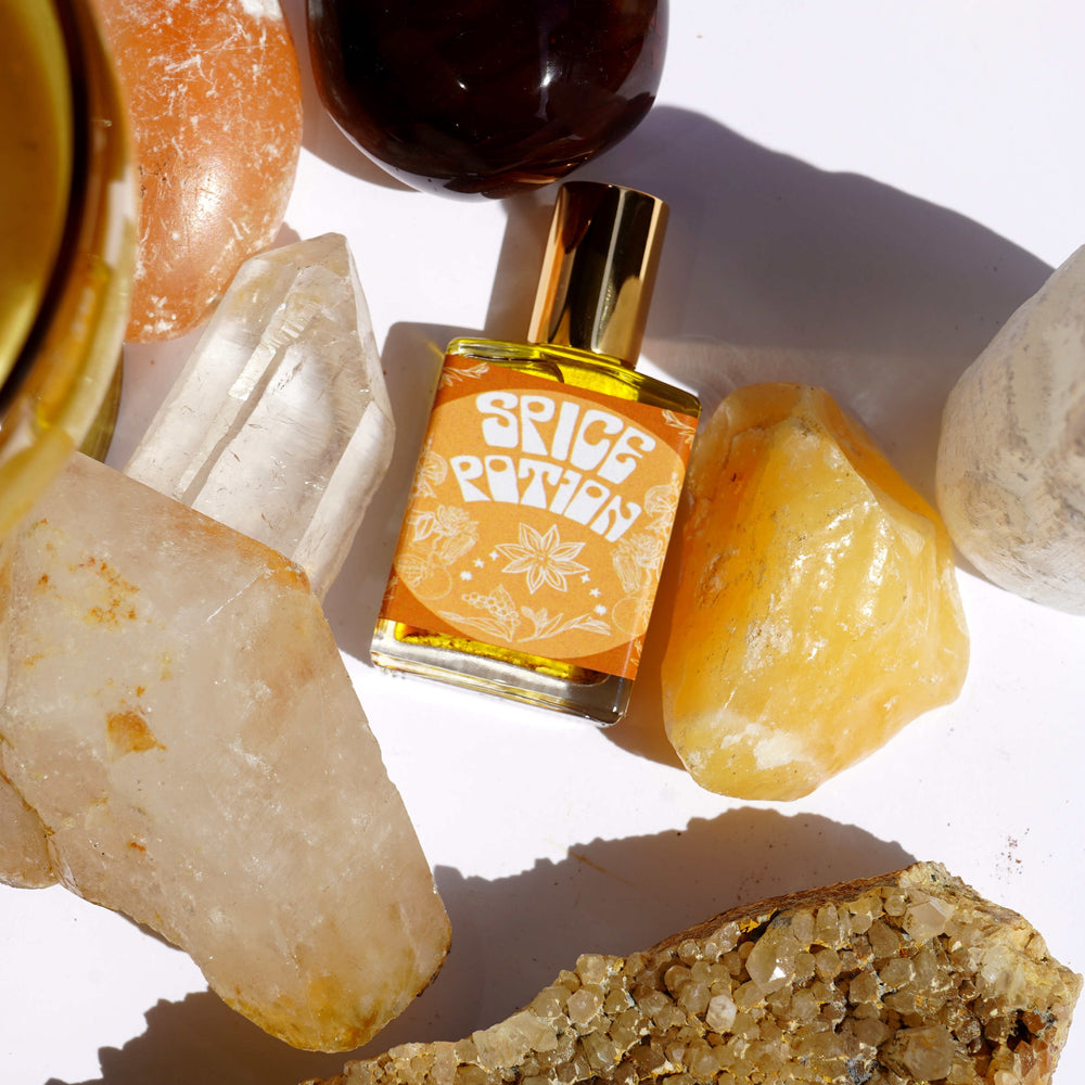 Wonderlust Botanicals Chai Spice Perfume Oil in a 0.5 oz roll-on bottle, offering a warm, spicy fragrance.