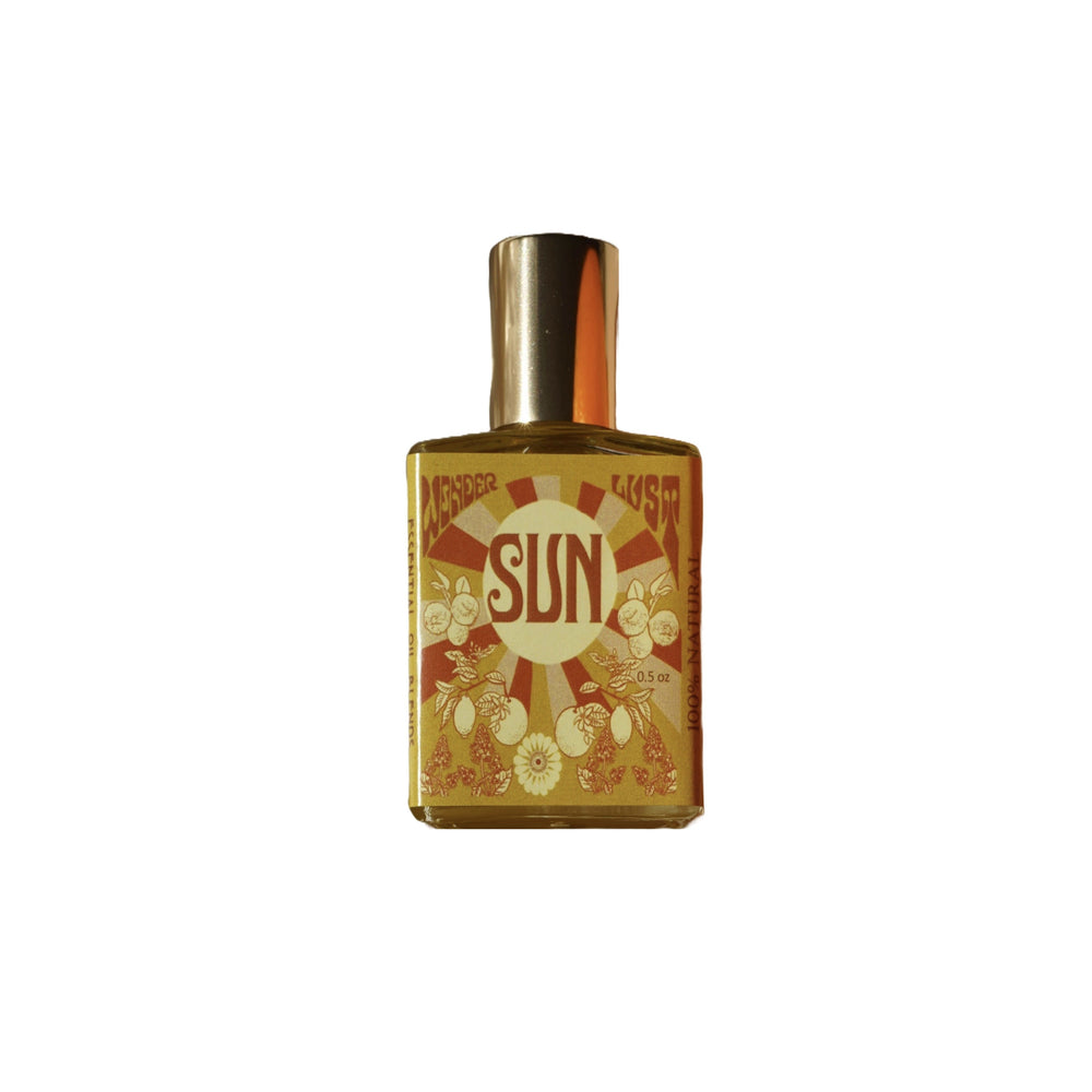 Wonderlust Botanicals Citrus & Patchouli Perfume Oil in a 0.5 oz roll-on bottle, offering a fresh and energizing blend of citrus and patchouli.