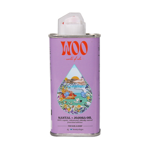 Lavender-colored can of WOO Santal + Jojoba Oil with a colorful label on a white background