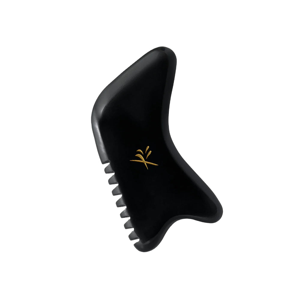 Yin Your Skin JALO Advanced Gua Sha Tool made of dark bian stone with serrated edge, U-notch, and hook-shaped end for facial massage.