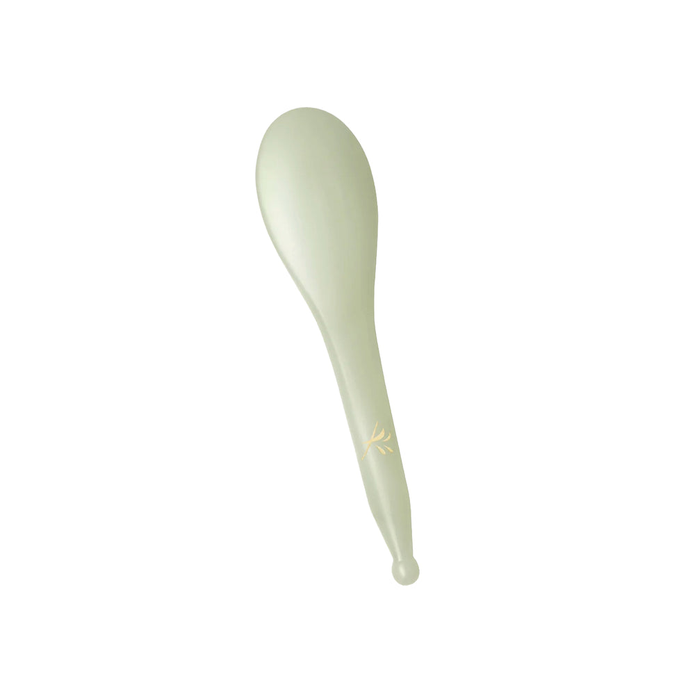 Yin Your Skin NIVA Gua Sha Beauty Spoon made of green Xiuyan jade, designed with smooth edges for facial and scalp massage.