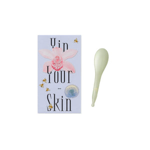 Yin Your Skin NIVA Gua Sha Beauty Spoon made of green Xiuyan jade, designed with smooth edges for facial and scalp massage.