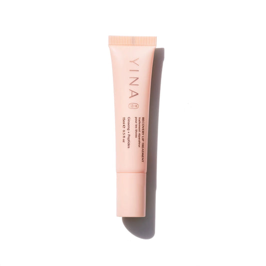 YINA Recovery Lip Balm in a sleek tube, featuring hydrating ingredients like ginseng, peptides, and shea butter for smooth, soft lips.