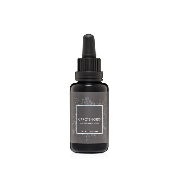 CREATION CAROTENOIDS Regenerative Serum in a glass dropper bottle, a vibrant, vitamin A–rich facial oil designed to brighten, protect, and restore skin radiance.