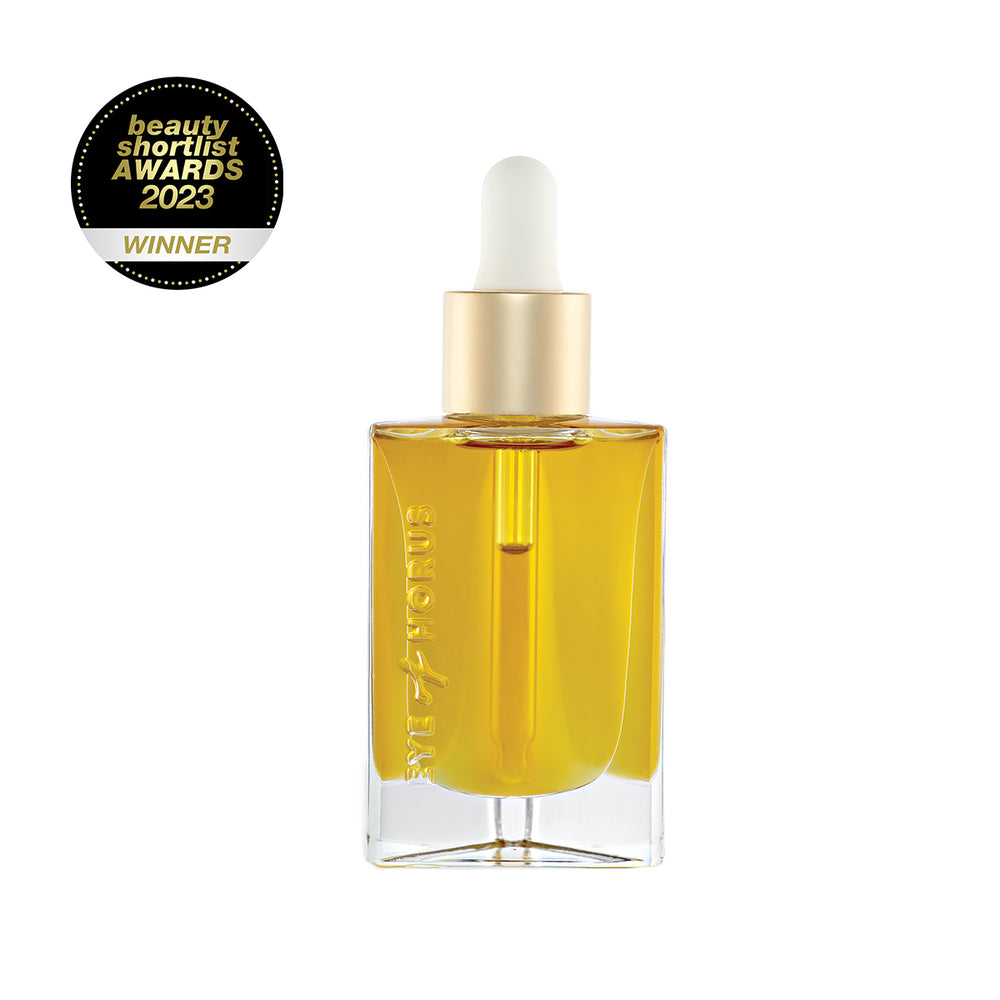 Eye of Horus Seven Seed Sacred Oil in a glass bottle with dropper. A luxurious facial elixir hand-blended with Moringa, Baobab, Marula, Hemp, Nigella, Pomegranate, and Abyssinian oils to hydrate, plump, and rejuvenate the skin.