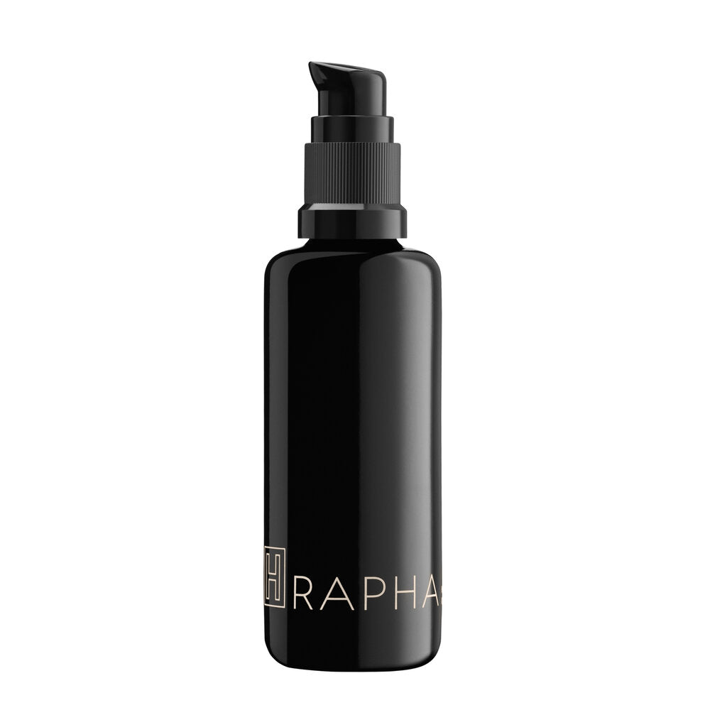 H is for Love RAPHA Harmonizing Oil Cleanser in a glass bottle with natural oils and herbs. The product hydrates and cleanses, leaving skin feeling balanced and refreshed.